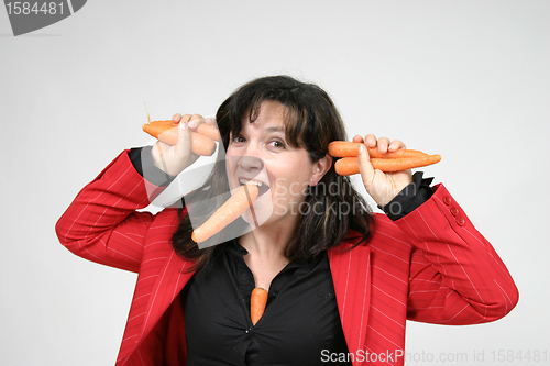 Image of woman with carrots, healthy food, health concept