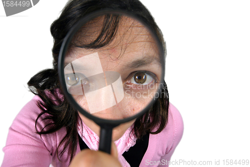 Image of Young businesswoman holding Magnifying Glass, business photo