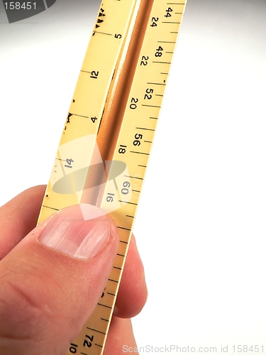 Image of Hand holding Ruler