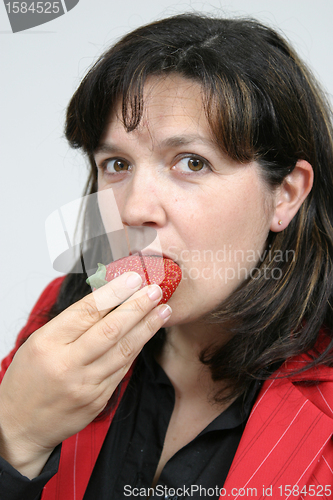 Image of beautiful woman with beautiful red strawberries, healthy food