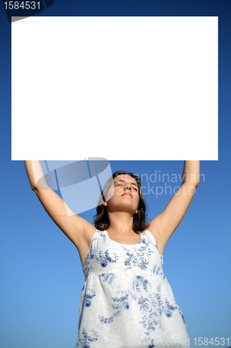 Image of Young woman holding blank board