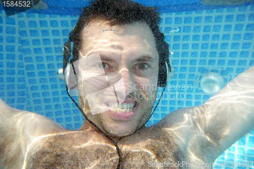 Image of man underwater listen music with head-phones