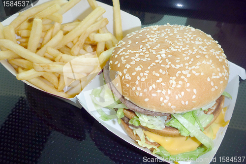 Image of Tasty hamburger with fries, unhealthy food, health concept