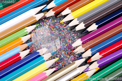 Image of Assortment of coloured pencils with shadow on white/back backgro