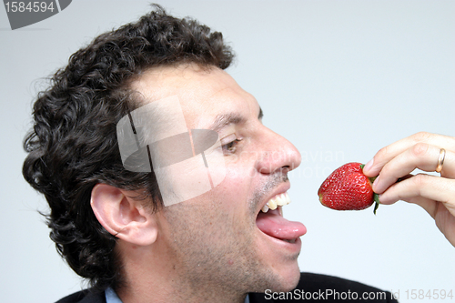 Image of man with strawberries, healthy food photo