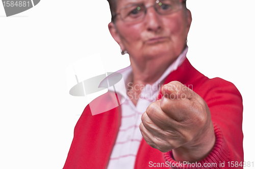 Image of angry grandmother clenchs fist