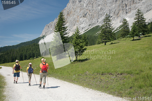 Image of 3 Hikers on Mountain Path