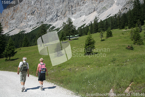 Image of Ols couple hiking in alps