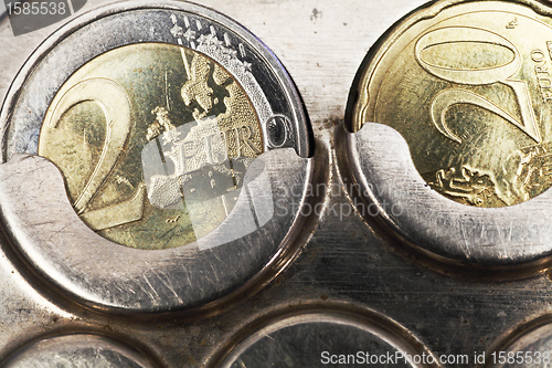 Image of two euro coins and twenty cents