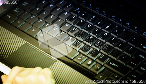 Image of Working at laptop .