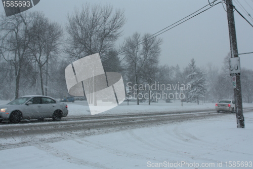 Image of Picture taken during a winter storm that passed by the city - cars on the busy street