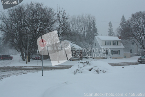 Image of  Picture taken during a winter storm that passed by the city - pile of snow at the corner