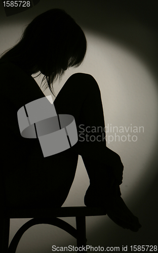 Image of silhouette of sitting woman