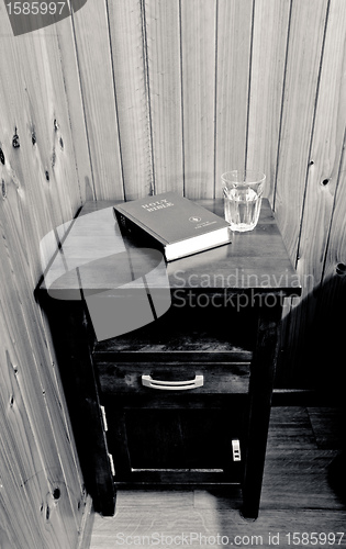 Image of bible on bed side table