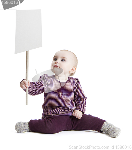 Image of toddler holding sign