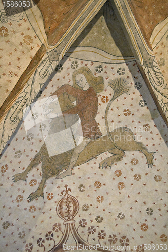 Image of Sason wrestling a lion