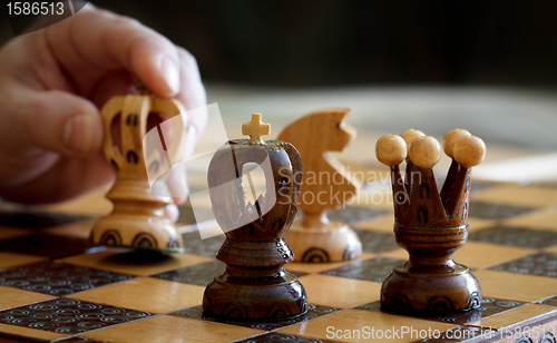Image of chess play with focus to black king in front