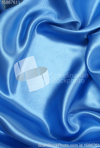 Image of Smooth elegant blue silk as background 