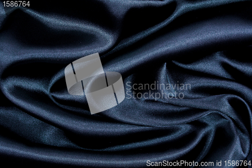 Image of Smooth elegant black silk as background 