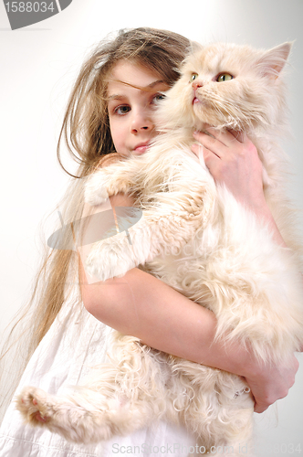 Image of kid  with a Persian cat