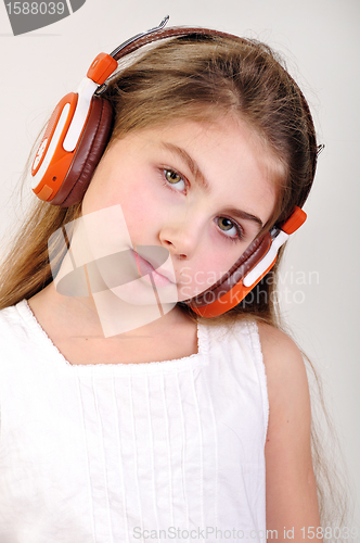 Image of child with headphones listening to music