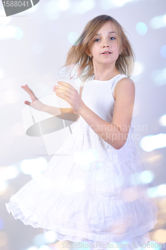 Image of dancing young blond child