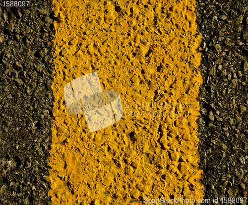 Image of asphalt yellow road markings macro background 