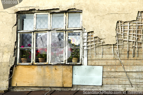 Image of crumble building collapsing wall windows. poverty 