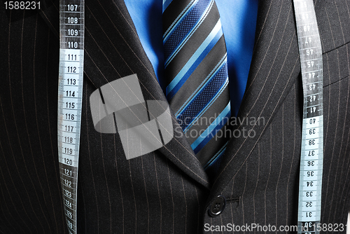 Image of Business man with tape measure