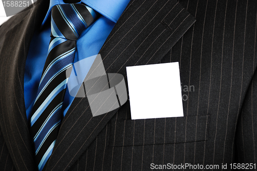 Image of Business man with business card in the pocket