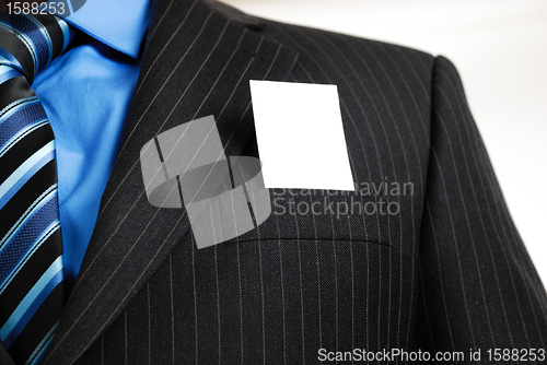 Image of Business man with business card in the pocket