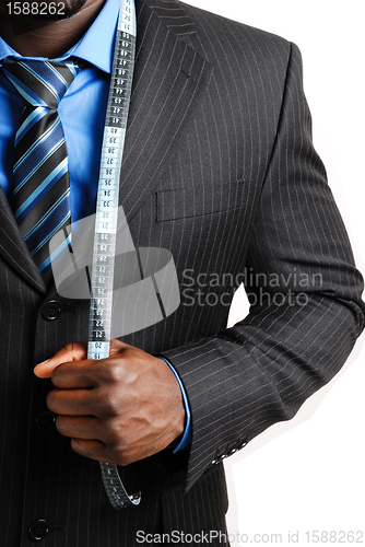 Image of Business man with tape measure