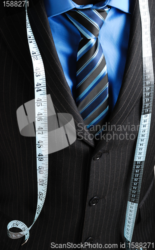 Image of Business man with tape measure