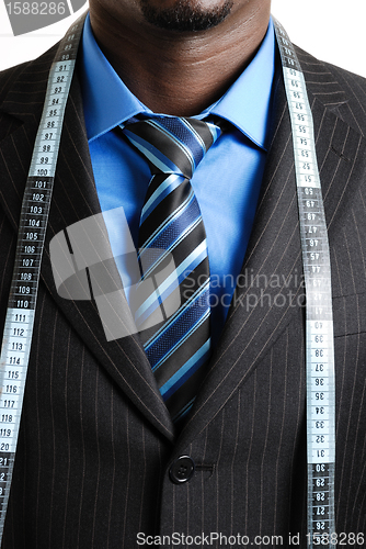 Image of Business man with tape measure