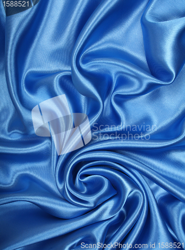 Image of Smooth elegant blue silk as background 