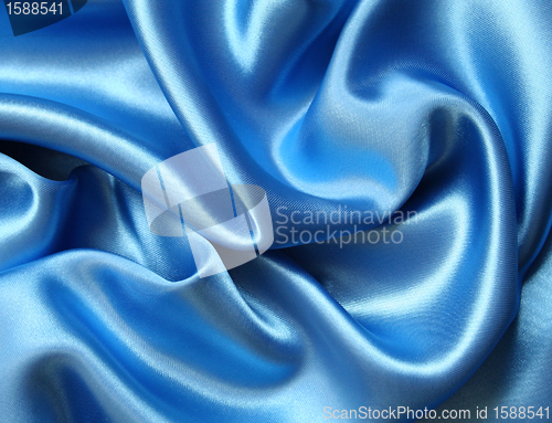 Image of Smooth elegant blue silk as background 