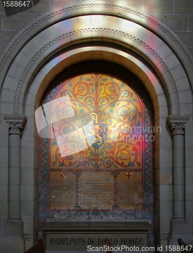 Image of Light from stained window on funerary.