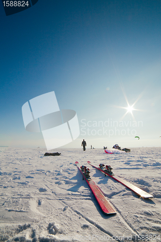 Image of Close up of skis and the person in a distance