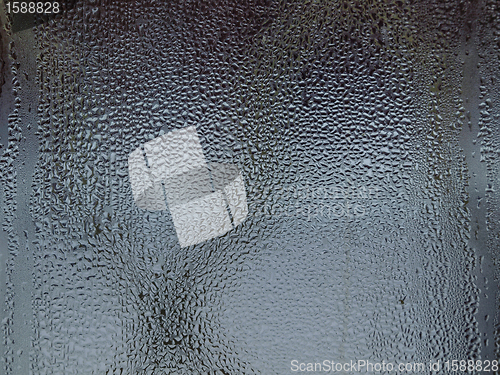 Image of Water drops on blue glass surface