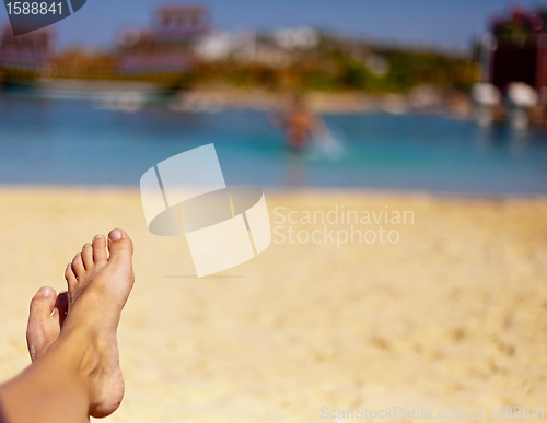 Image of sandy feet on the beach