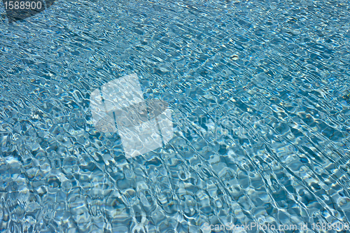 Image of beautiful clear pool water reflecting in the sun