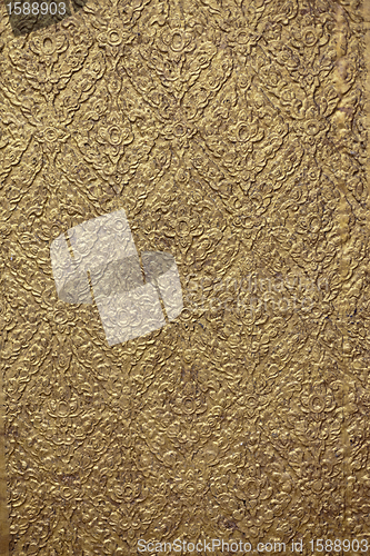 Image of brown background with golden patterns