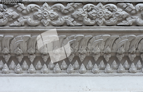 Image of White stucco , thai style on the Wall