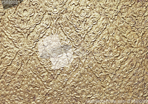 Image of brown background with golden patterns