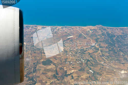 Image of View through airplane porthole