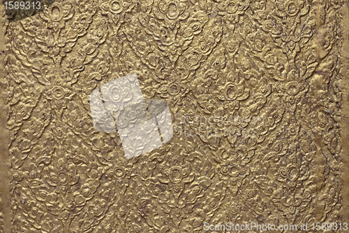 Image of brown background with golden patterns