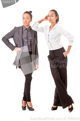 Image of two business  women in casual poses