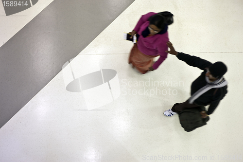 Image of Moving people from above at the airport