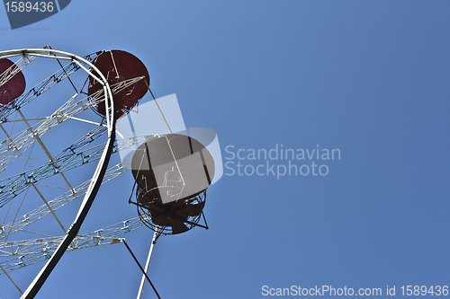 Image of ferris wheel against a blue sky