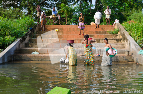 Image of Central Sri Lanka, December 4, 2012. Peasants are cleaning on th